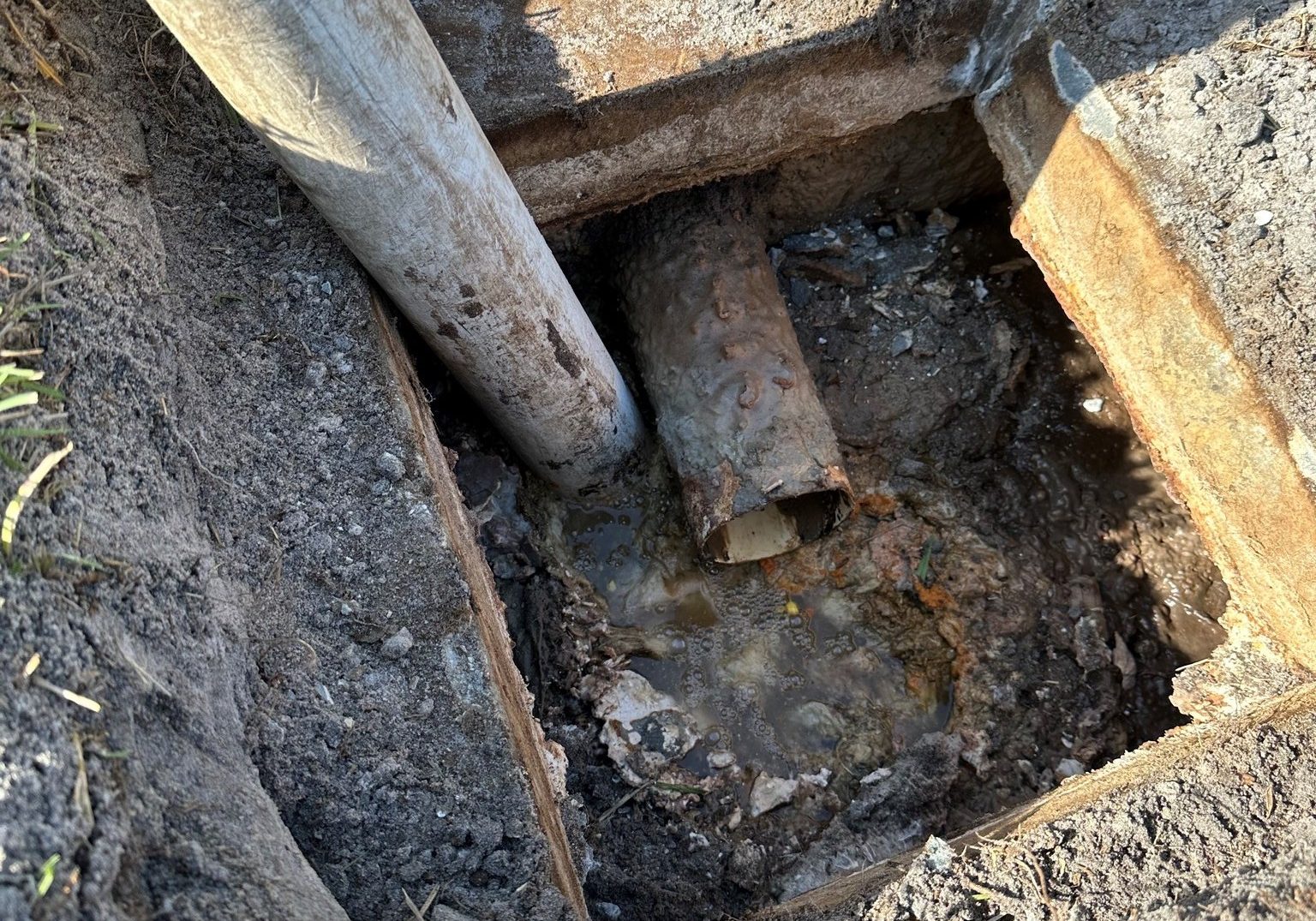 Backed up septic tank undergoing emergency septic pump out in Port Charlotte Florida
