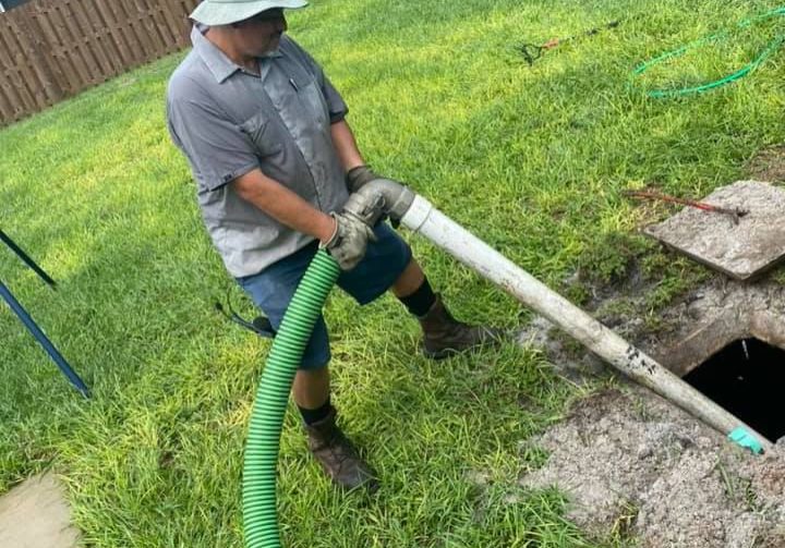 P.O.P'S Environmental owner Alex Dominguez performs emergency septic pump out on backed up septic tank in Charlotte County Florida